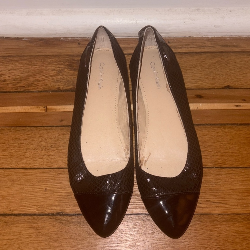 Calvin Klein flat. Signs of wear.